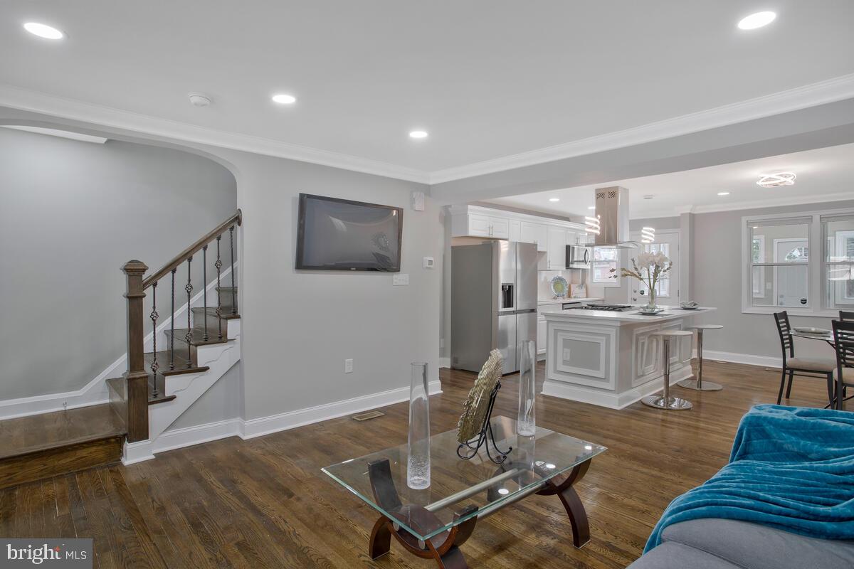 4243 Flowerton Road Baltimore, MD 21229 - Photo 4 of 35 a living room with furniture and kitchen view