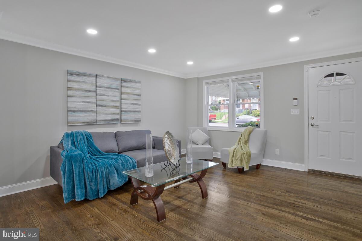 4243 Flowerton Road Baltimore, MD 21229 - Photo 5 of 35 a living room with furniture and a wooden floor