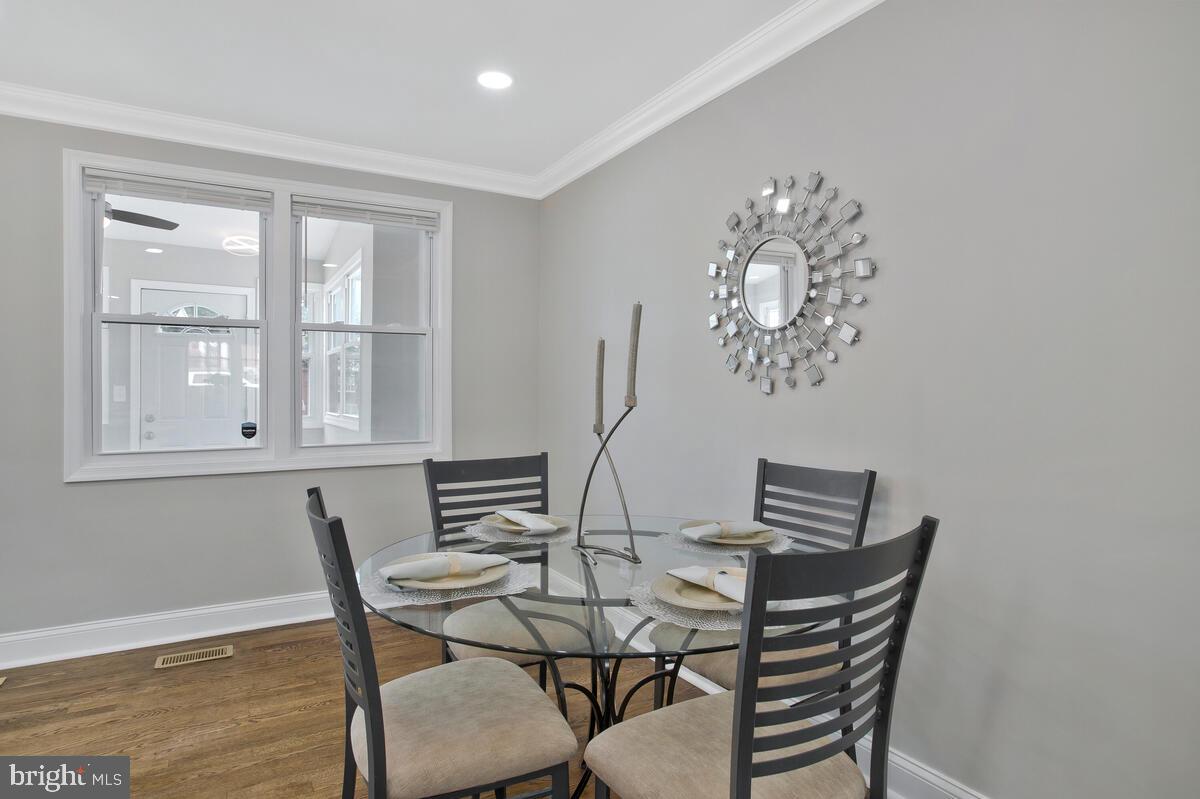 4243 Flowerton Road Baltimore, MD 21229 - Photo 7 of 35 a view of a dining room with furniture and chandelier