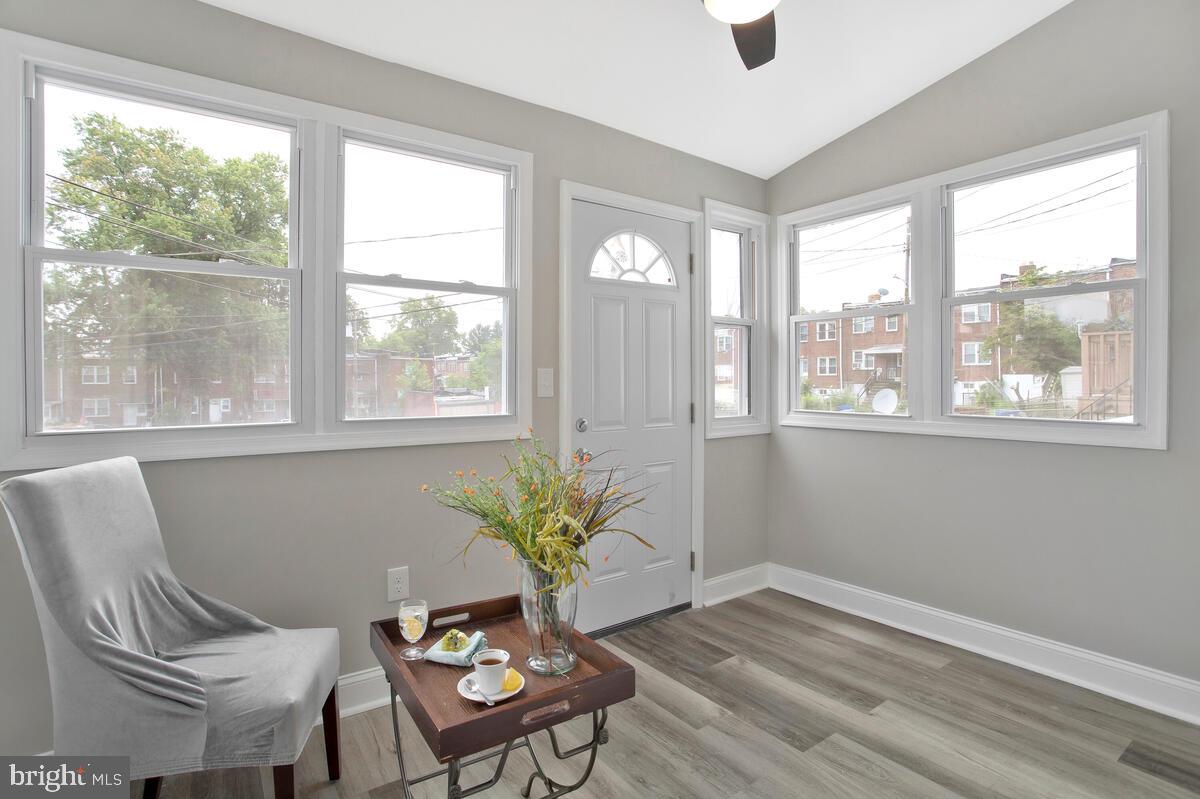 4243 Flowerton Road Baltimore, MD 21229 - Photo 8 of 35 a living room with furniture and a potted plant