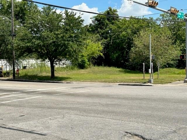 7508 Navigation Houston, TX 77012 - Photo 3 of 4 a view of a yard in front of a house with large trees