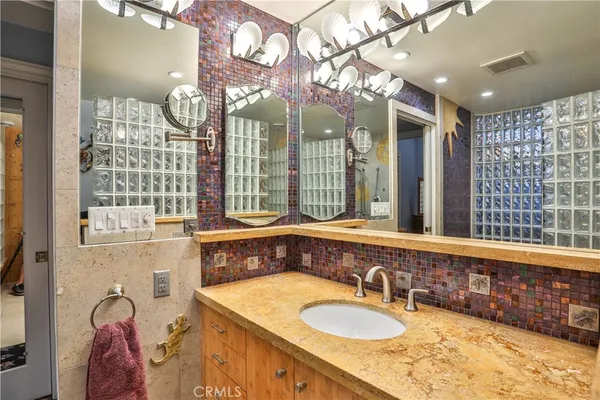 a bathroom with a bathtub and shower