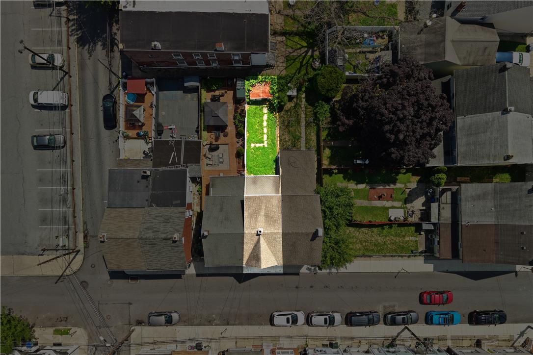 431 Pierce Street Bethlehem, PA 18015 - Photo 21 of 27 An aerial perspective showcases the urban landscape with multiple buildings and a distinct green space in the heart of the neighborhood.