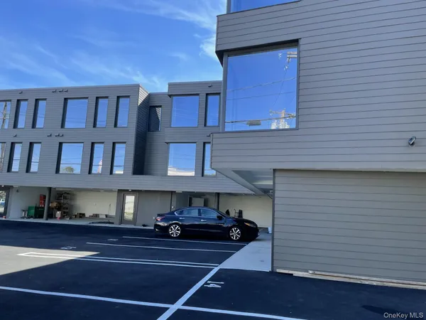 a view of a car parked in front of a building