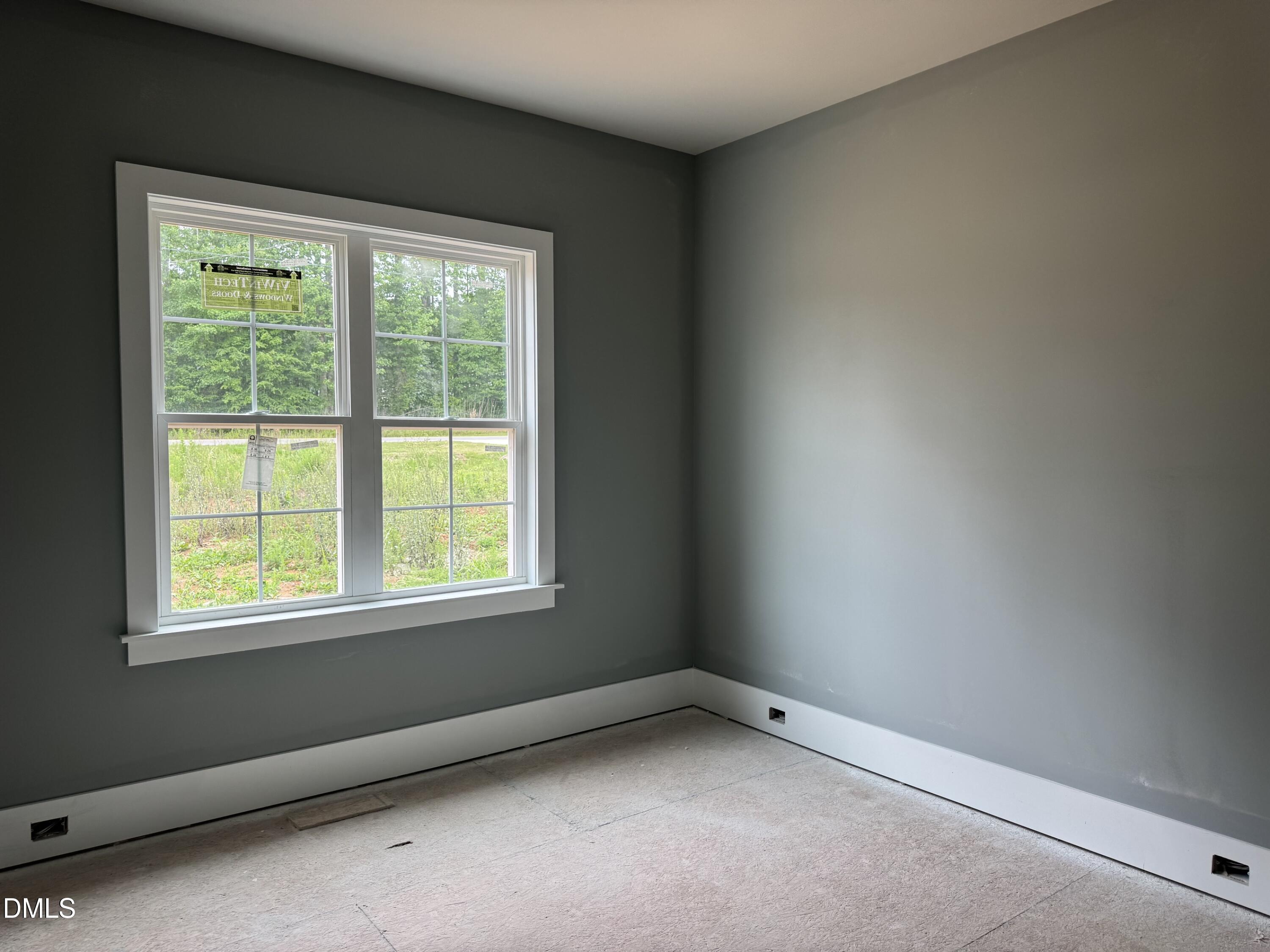 935 Lynch Road Selma, NC 27576 - Photo 13 of 21 an empty room with a window