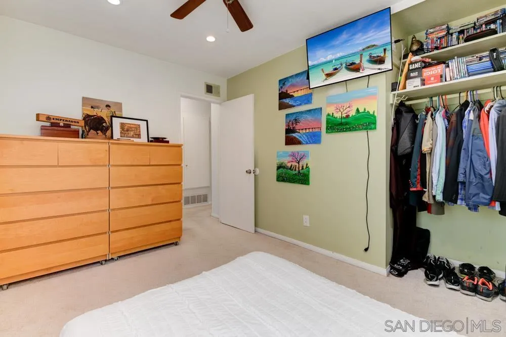 10423 Caminito Rimini San Diego, CA 92129 - Photo 16 of 25 a bedroom with a bed and a closet