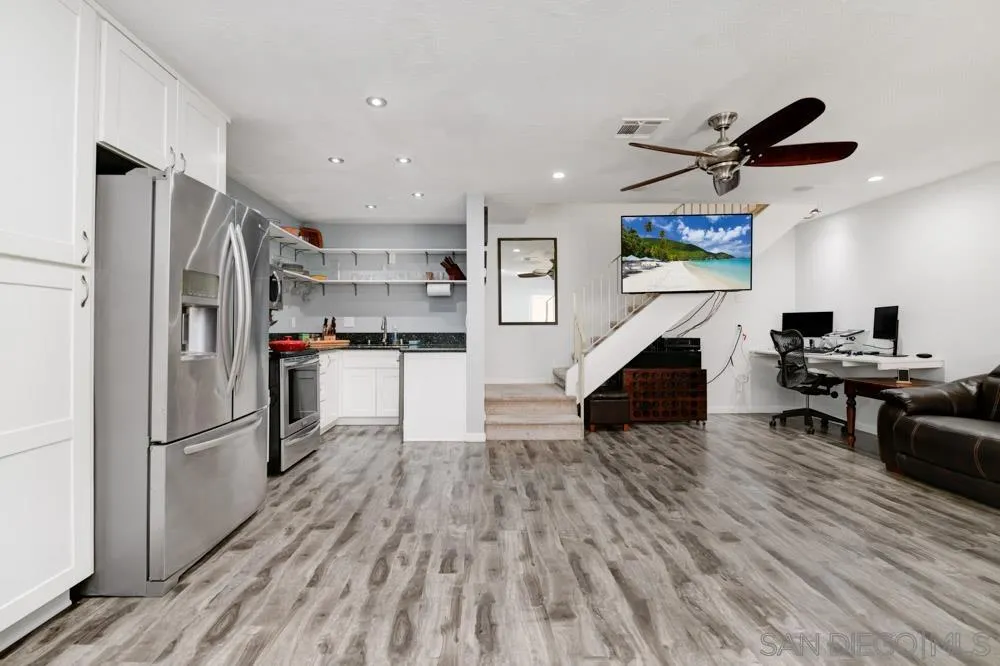 10423 Caminito Rimini San Diego, CA 92129 - Photo 2 of 25 a kitchen with stainless steel appliances granite countertop a refrigerator and a stove top oven