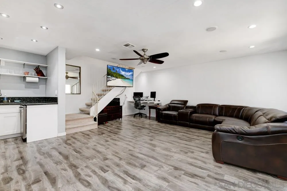 10423 Caminito Rimini San Diego, CA 92129 - Photo 3 of 25 a living room with furniture and a wooden floor