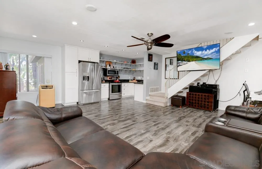 10423 Caminito Rimini San Diego, CA 92129 - Photo 5 of 25 a living room with furniture and a chandelier