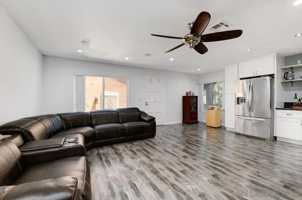 10423 Caminito Rimini San Diego, CA 92129 - Photo 6 of 25 a living room with furniture and a ceiling fan
