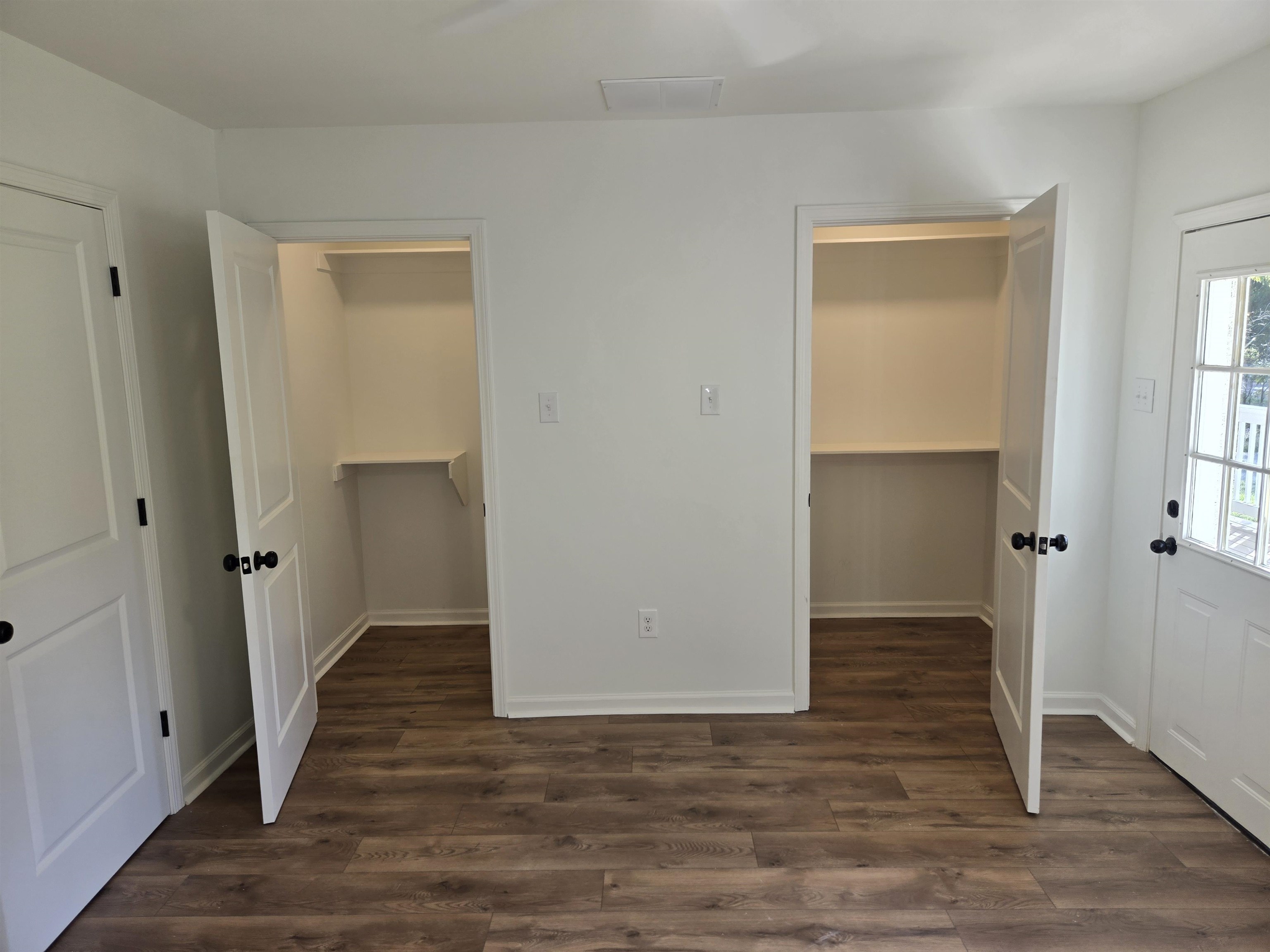 880 Pisgah Road Eads, TN 38028 - Photo 13 of 19 Unfurnished bedroom with dark wood-style flooring, a spacious closet, and a ceiling fan