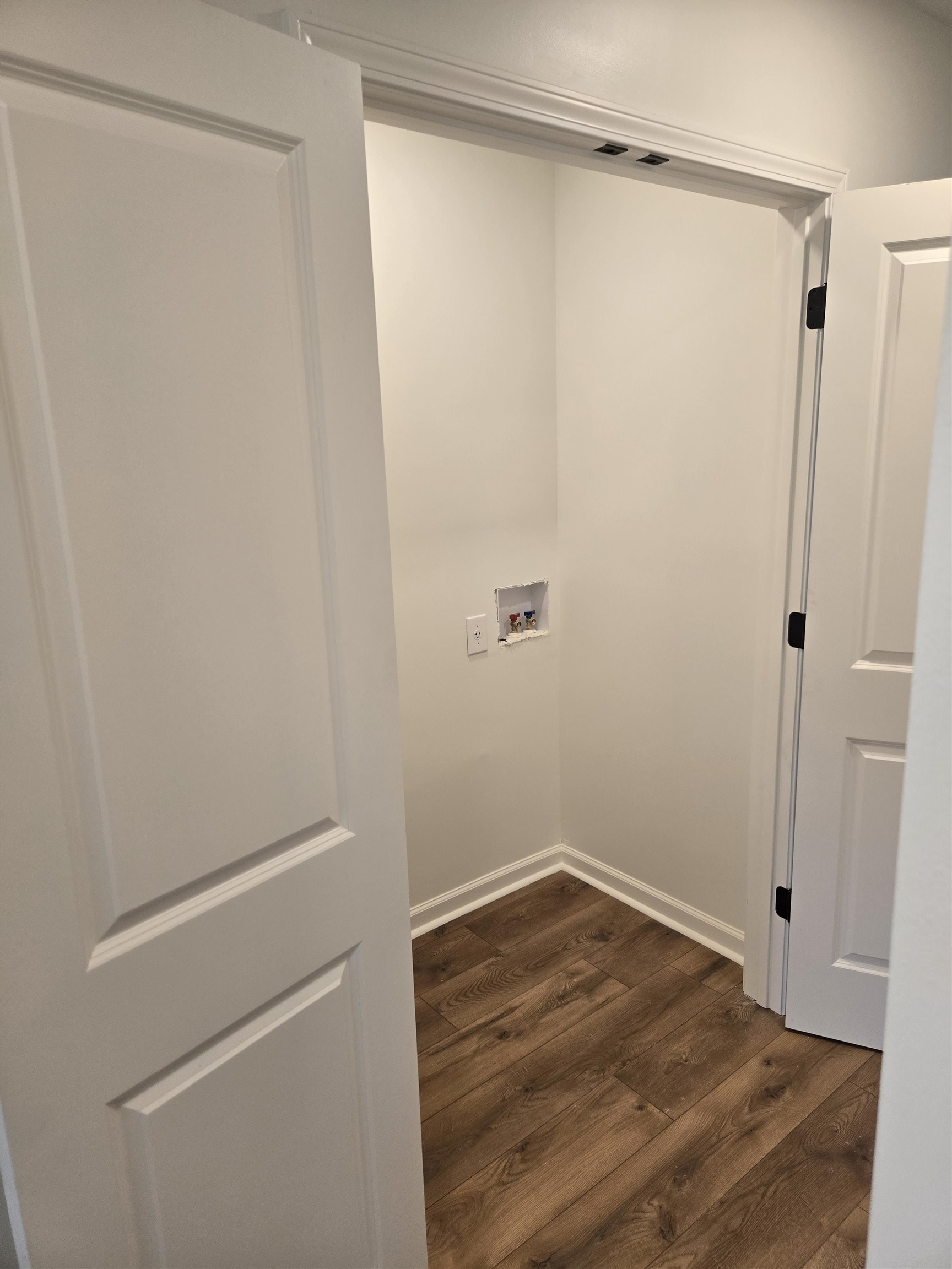 880 Pisgah Road Eads, TN 38028 - Photo 14 of 19 Washroom featuring dark wood finished floors and washer hookup