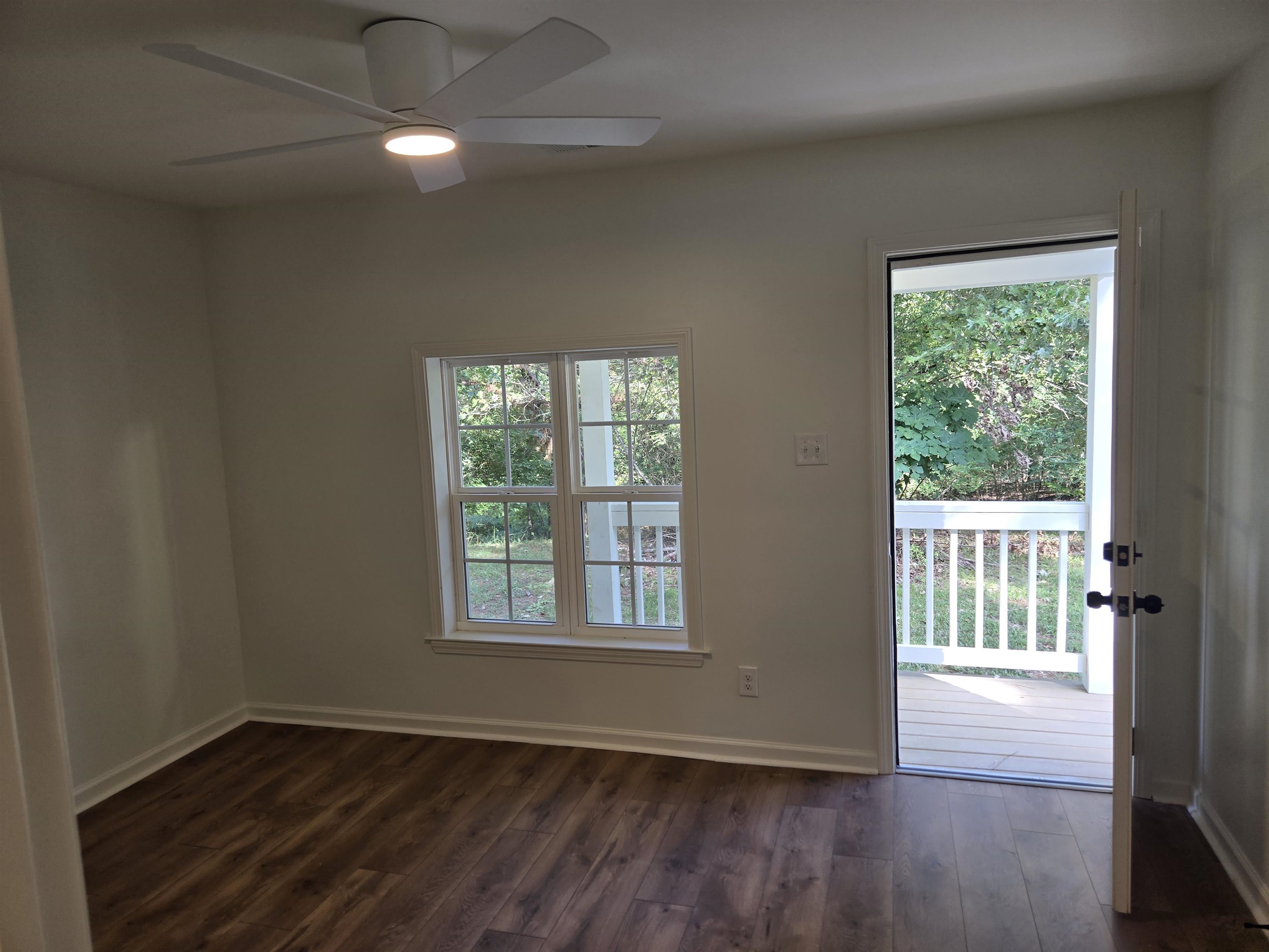 880 Pisgah Road Eads, TN 38028 - Photo 15 of 19 Unfurnished room with plenty of natural light, dark wood finished floors, and a ceiling fan