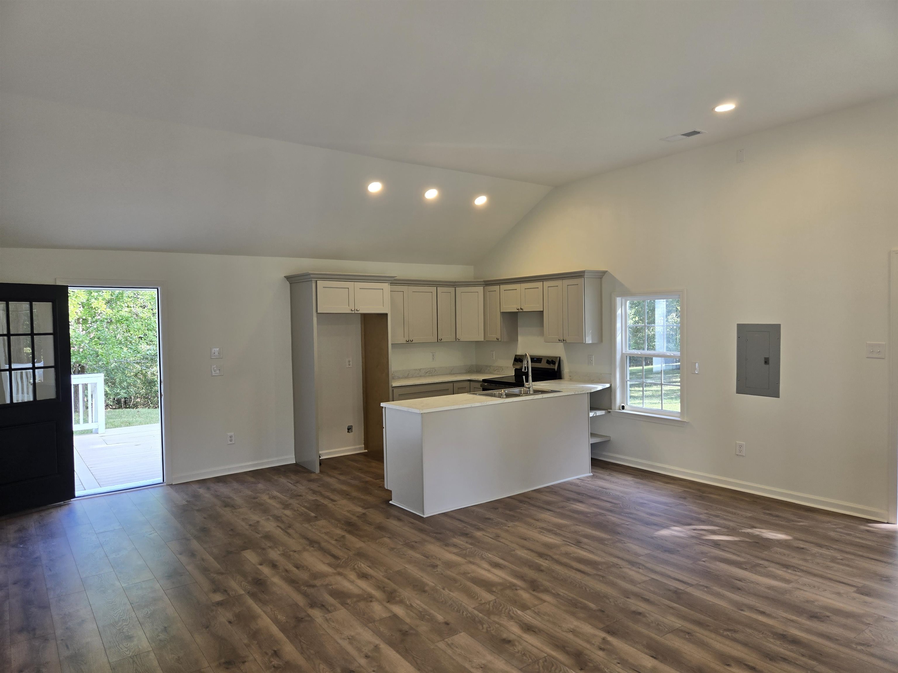 880 Pisgah Road Eads, TN 38028 - Photo 18 of 19 Kitchen with a peninsula, light countertops, dark wood-style flooring, gray cabinetry, and open floor plan