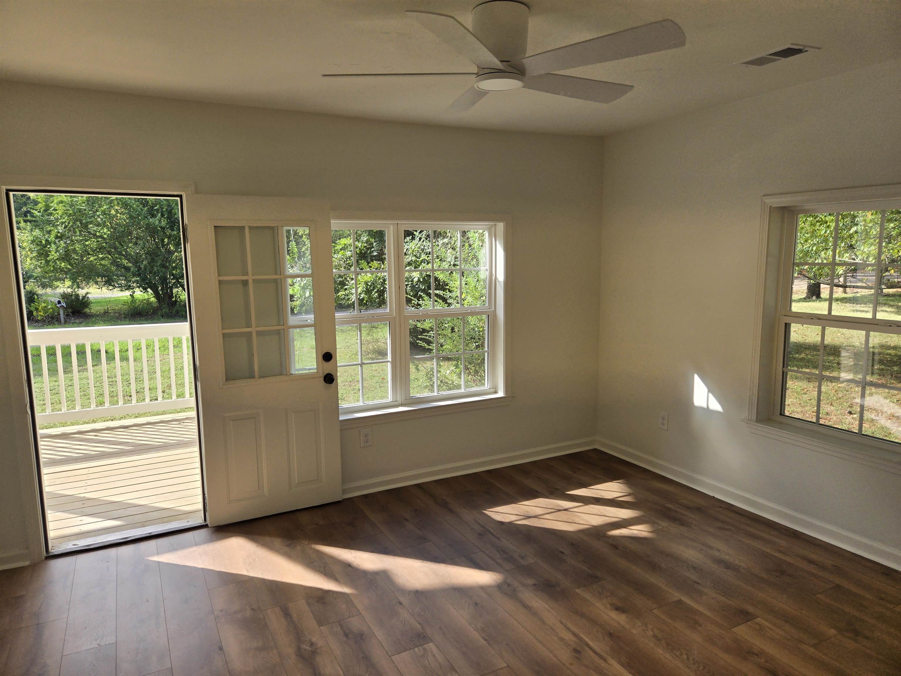 880 Pisgah Road Eads, TN 38028 - Photo 5 of 19 Unfurnished room with dark wood-type flooring and ceiling fan