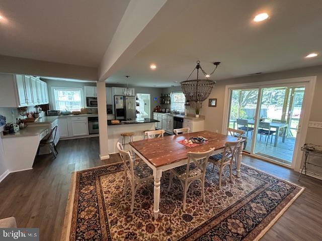 8090 Bozman Neavitt Road St. Michaels, MD 21663 - Photo 16 of 33 a view of a dining room with furniture window and wooden floor
