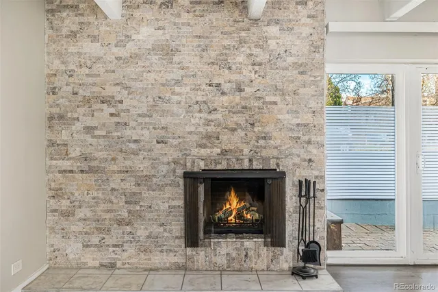 a front view of a house with a yard and lake view