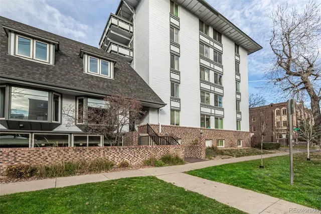 a view of a building with a yard