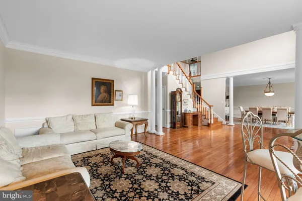 a living room with furniture tv and a flat screen tv