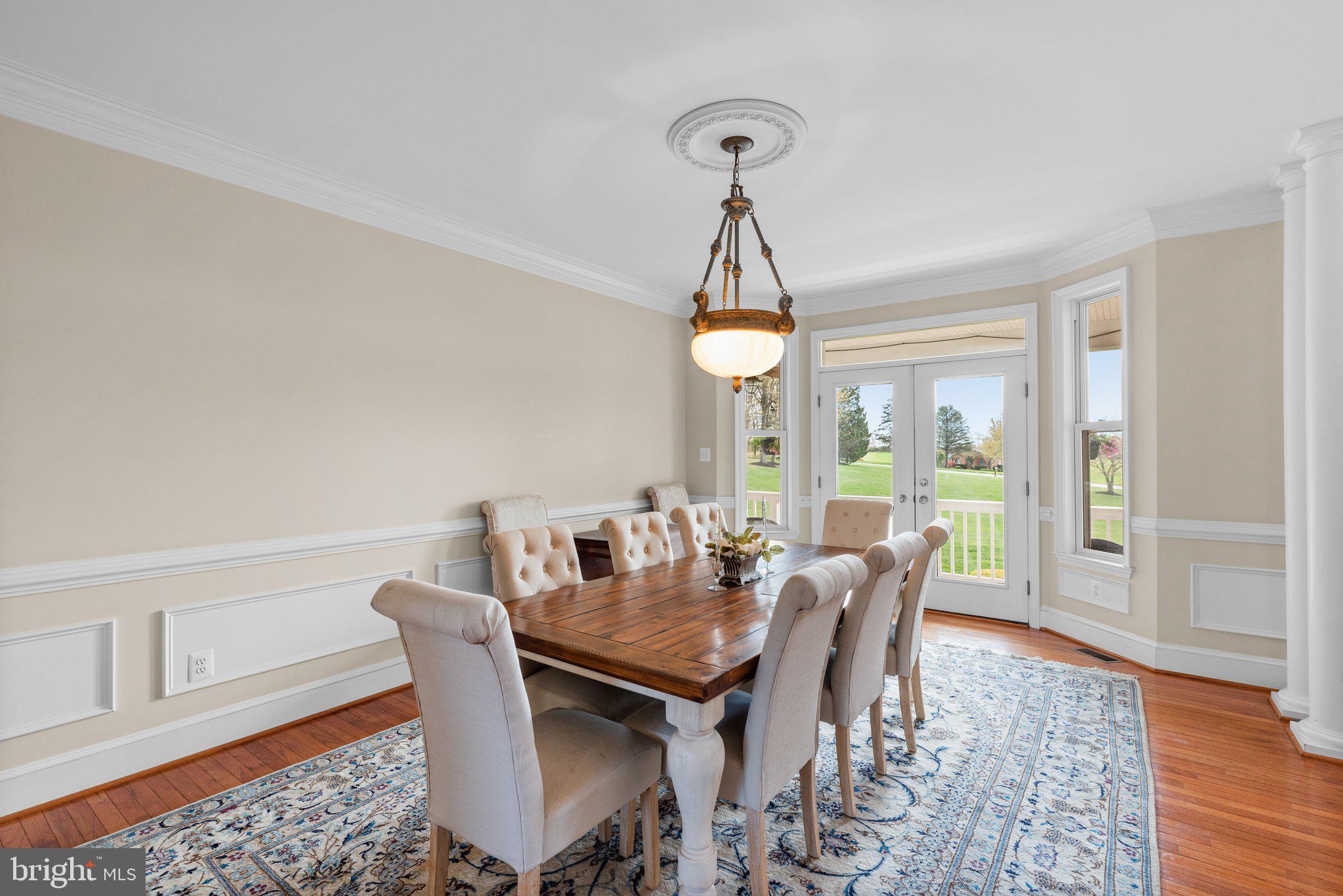 10855 Bethesda Church Road Damascus, MD 20872 - Photo 13 of 92 a view of a dining room with furniture wooden floor and chandelier