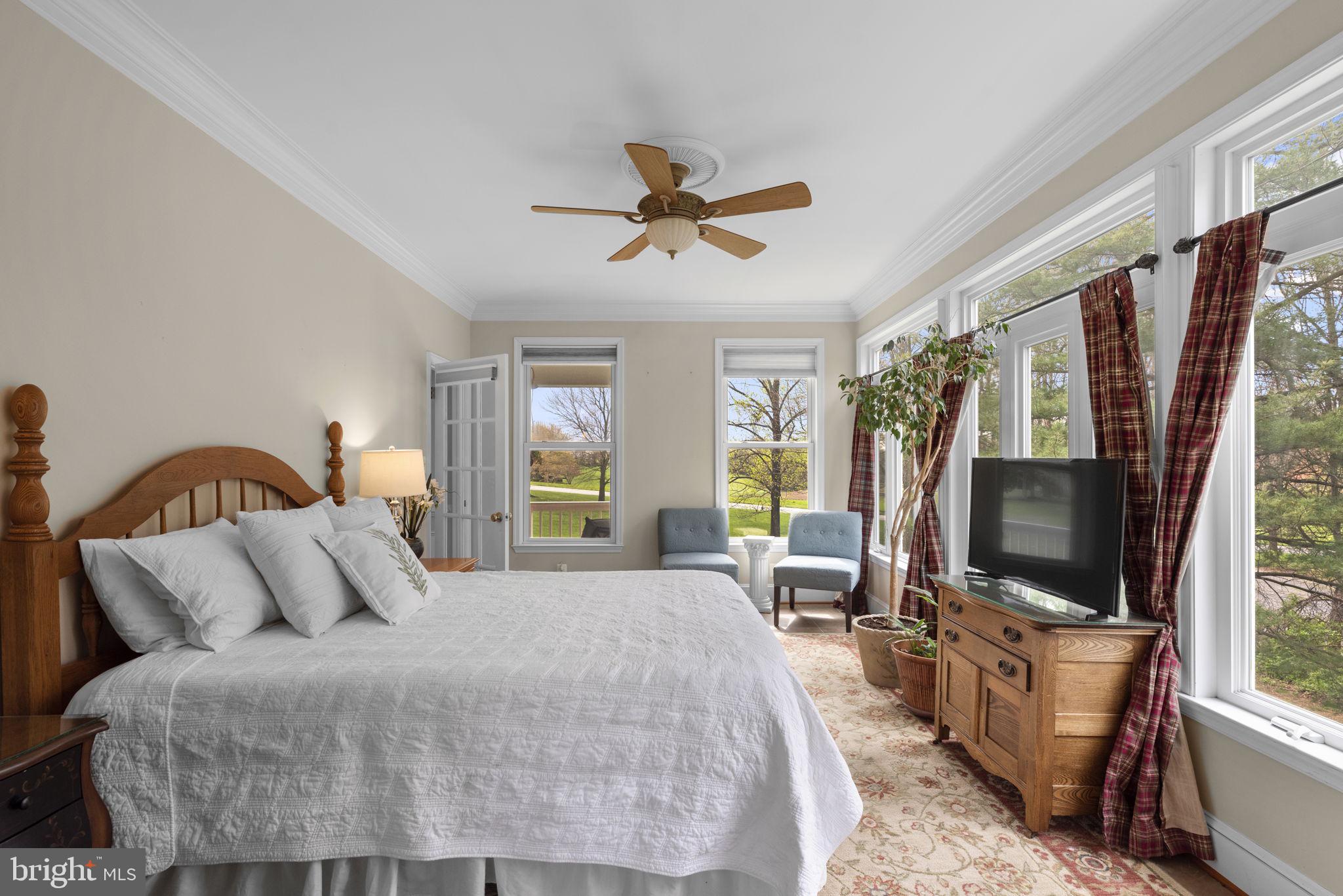 10855 Bethesda Church Road Damascus, MD 20872 - Photo 28 of 92 a bedroom with a bed a flat screen tv and a faucet