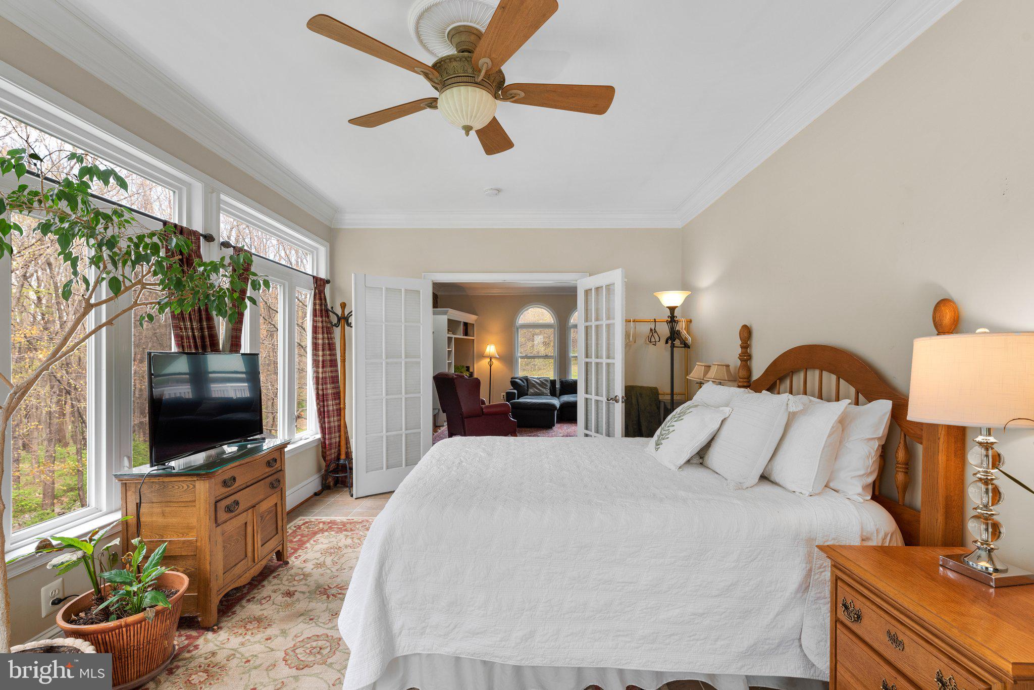 10855 Bethesda Church Road Damascus, MD 20872 - Photo 30 of 92 a bedroom with a bed and a flat screen tv