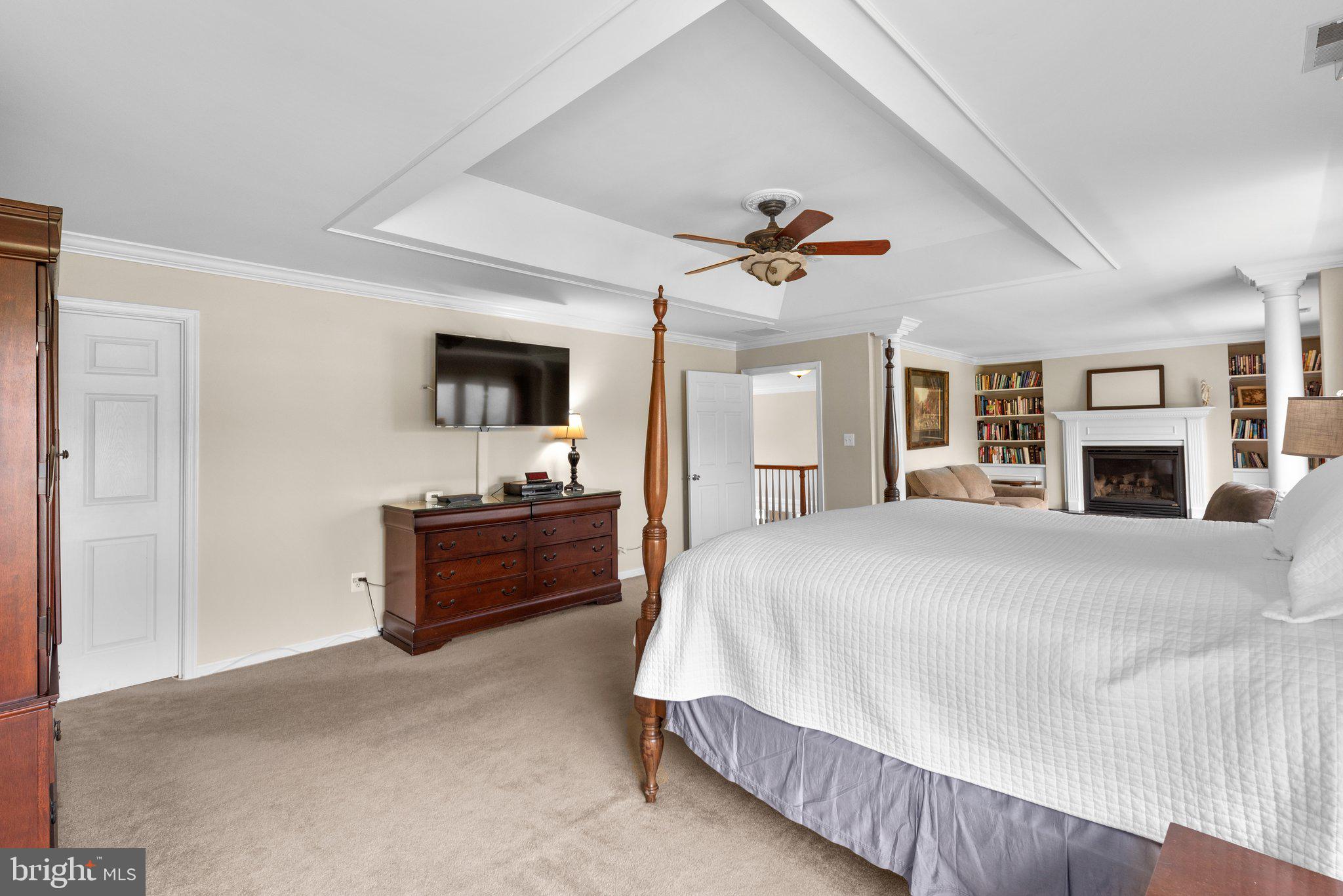 10855 Bethesda Church Road Damascus, MD 20872 - Photo 45 of 92 a spacious bedroom with a bed and a flat screen tv