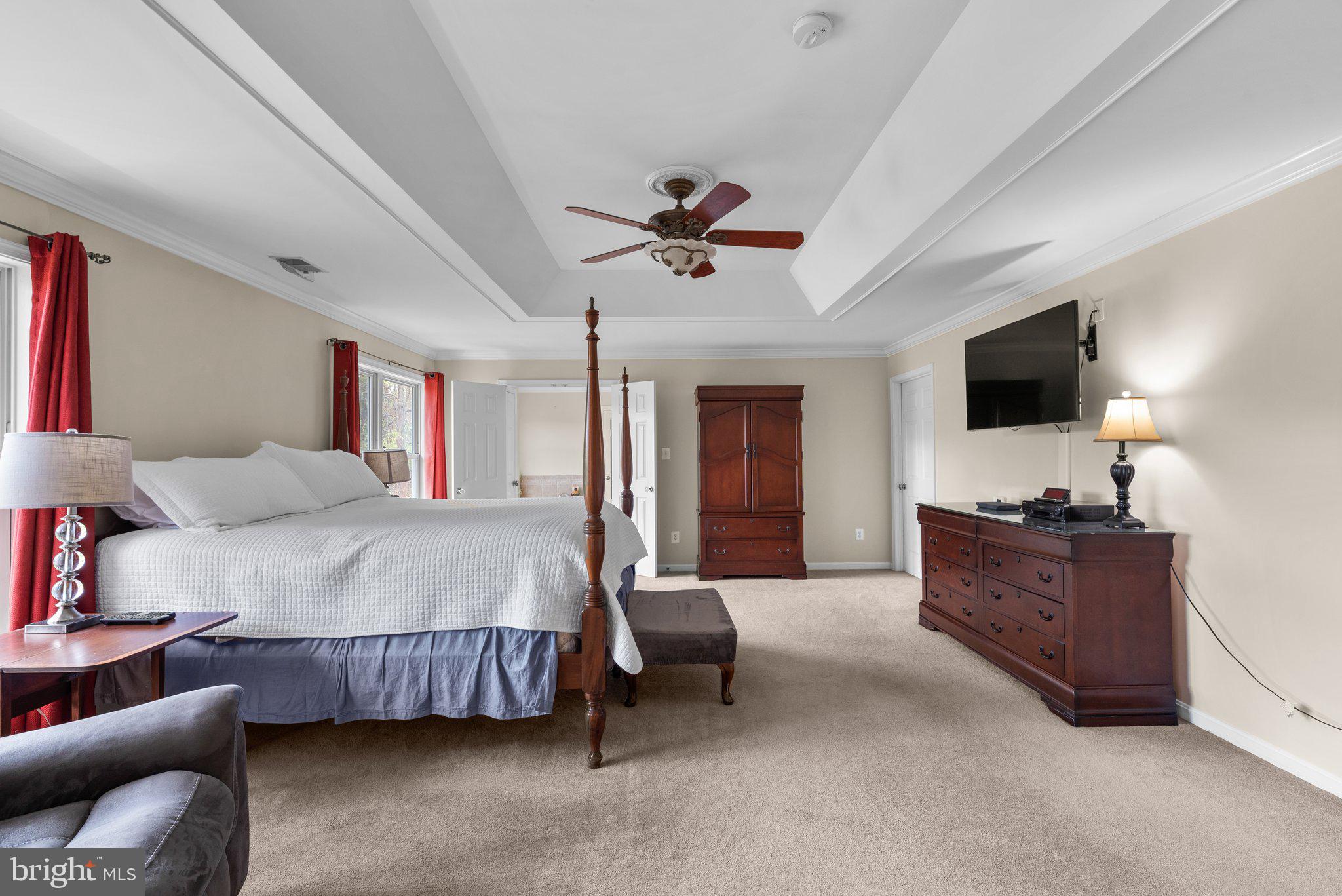 10855 Bethesda Church Road Damascus, MD 20872 - Photo 46 of 92 a spacious bedroom with a bed and a flat screen tv