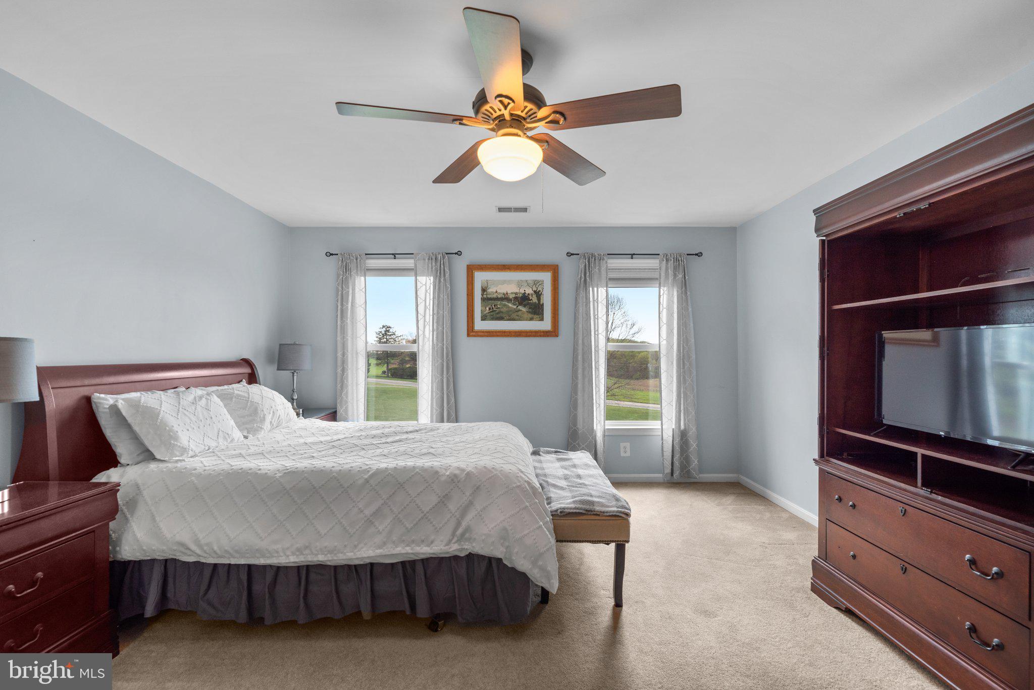 10855 Bethesda Church Road Damascus, MD 20872 - Photo 53 of 92 a bedroom with a bed and a dresser in it