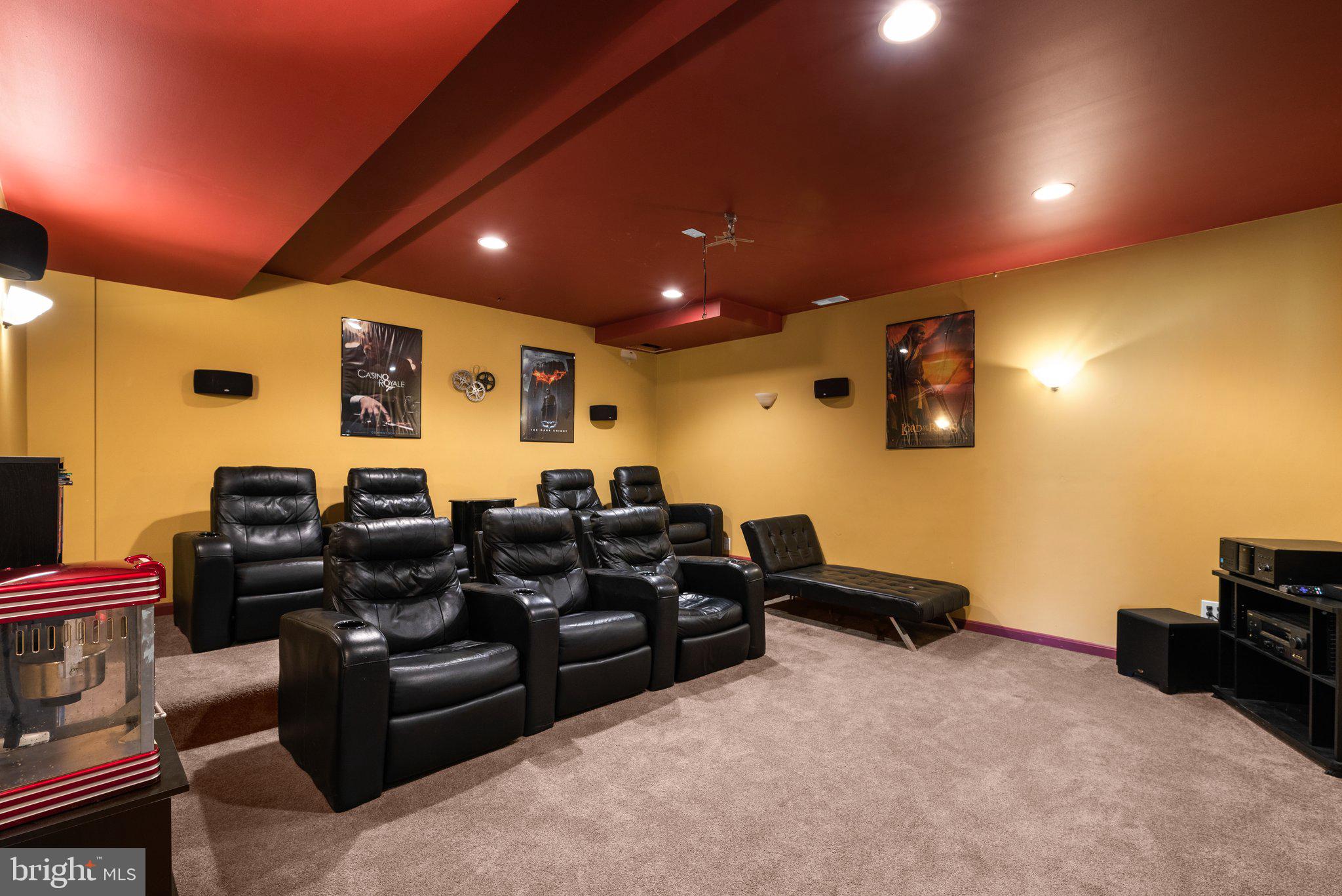 10855 Bethesda Church Road Damascus, MD 20872 - Photo 63 of 92 a media room with lots of chairs and a projector screen