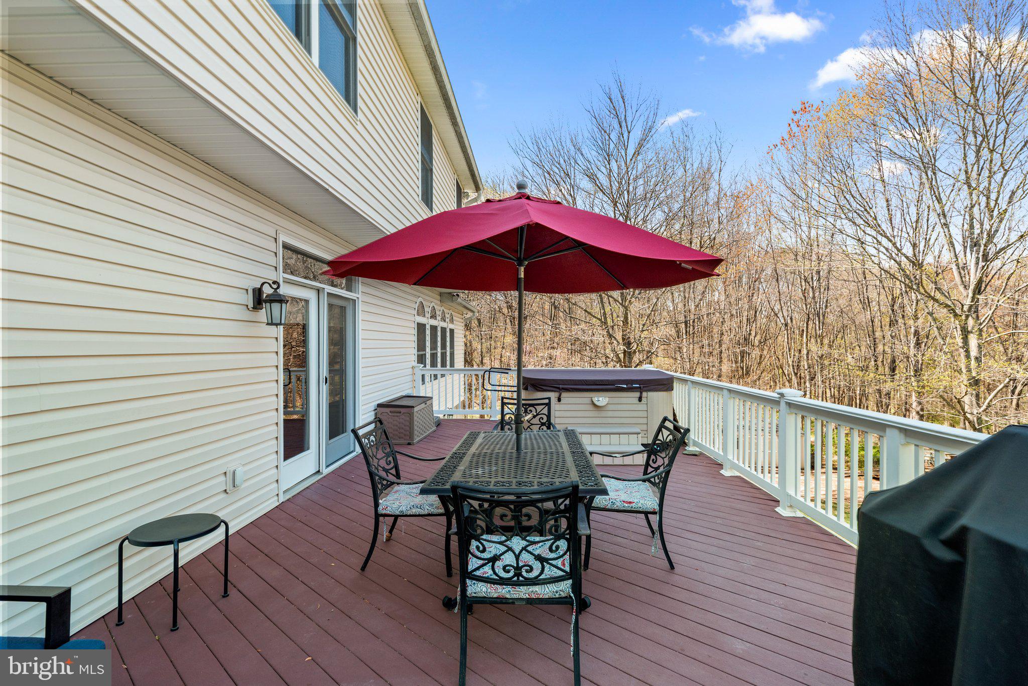 10855 Bethesda Church Road Damascus, MD 20872 - Photo 69 of 92 a view of deck with furniture and barbeque oven with wooden floor