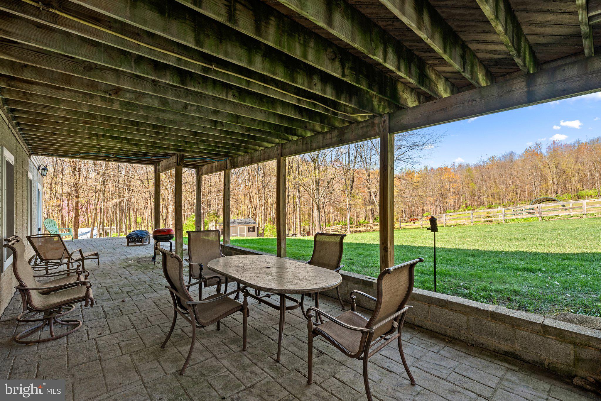 10855 Bethesda Church Road Damascus, MD 20872 - Photo 70 of 92 a view of a patio with a table chairs and a couple of chairs