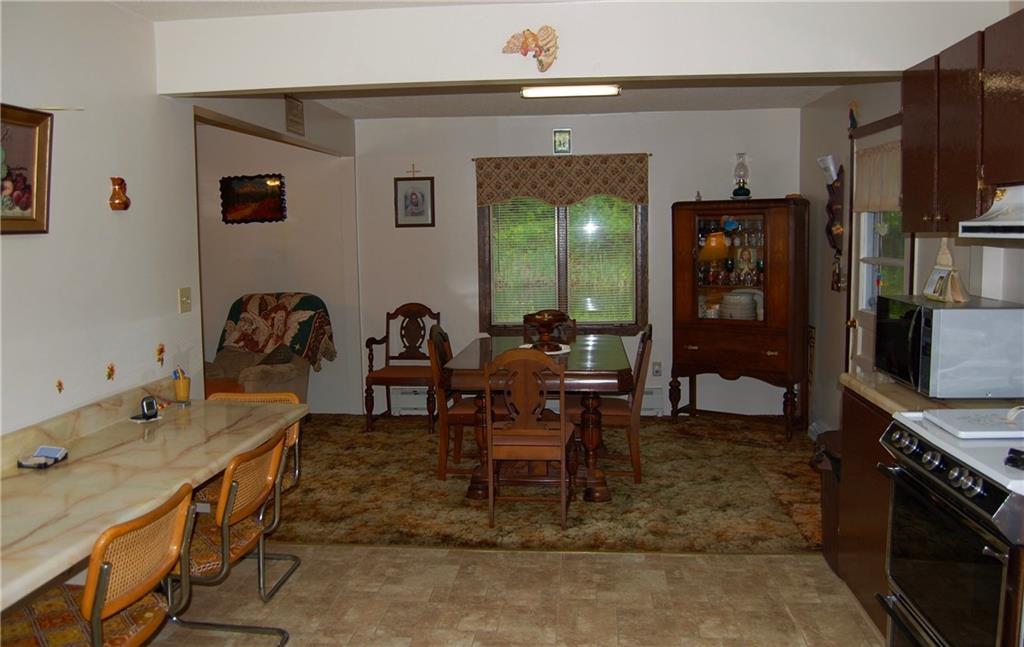 394 Crash Road Jay, ME 04239 - Photo 3 of 33 Kitchen opens into dining room.