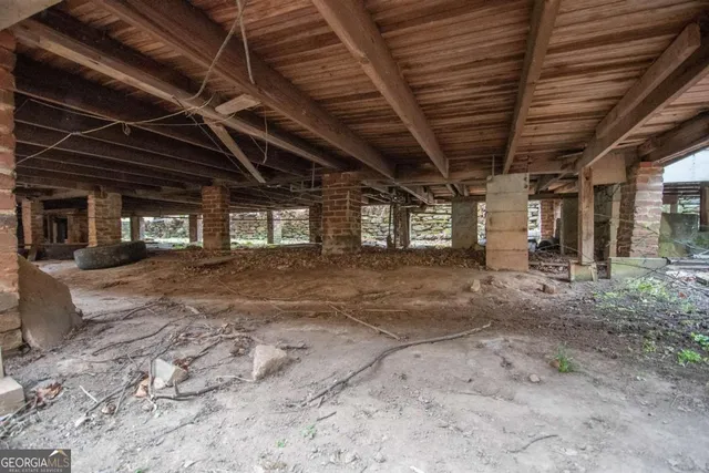 a view of a room with wooden roof