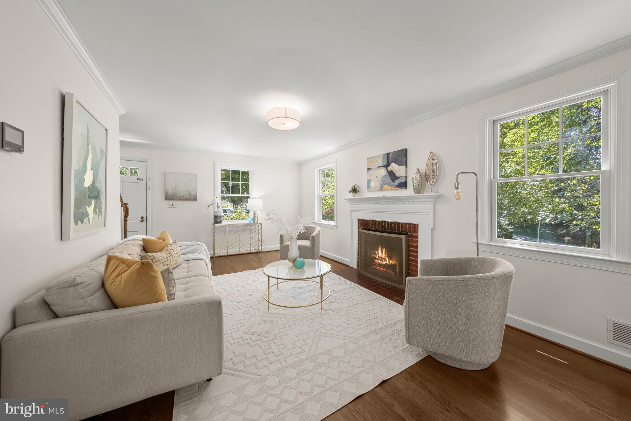 8800 Maywood Avenue Silver Spring, MD 20910 - Photo 4 of 41 a living room with furniture and a fireplace