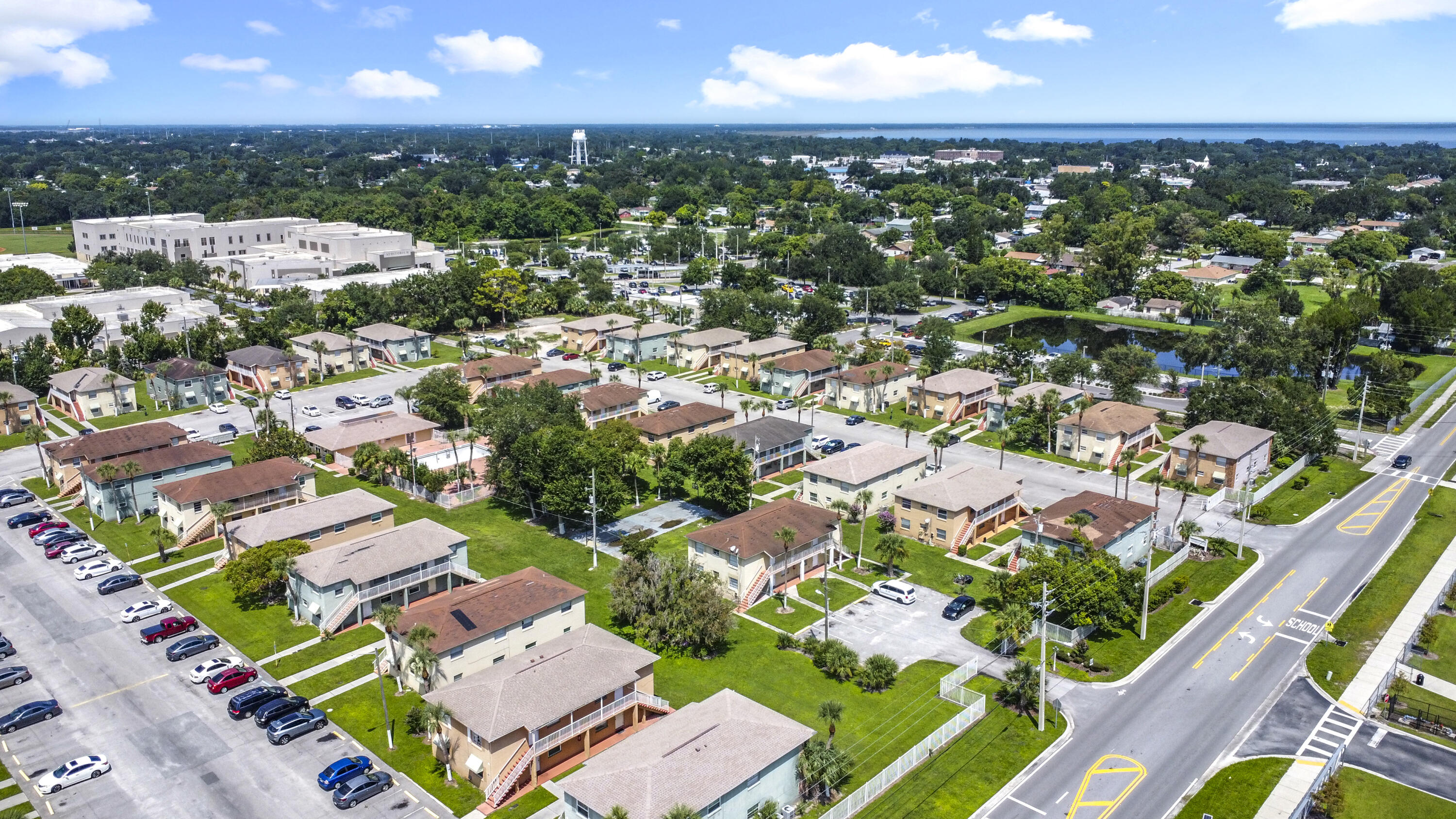 an aerial view of residential houses with outdoor space