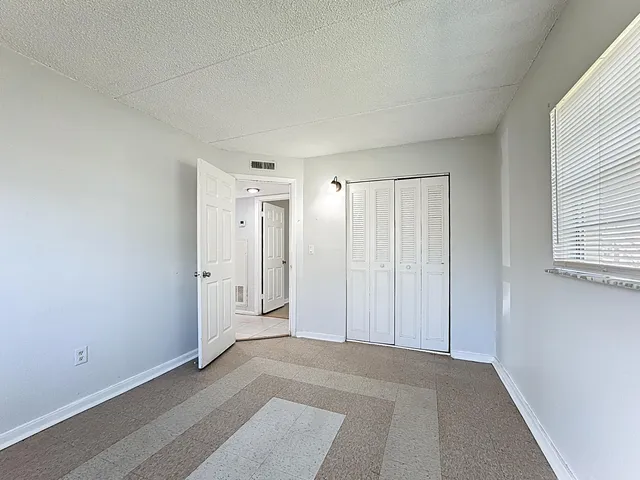 a view of an empty room and window