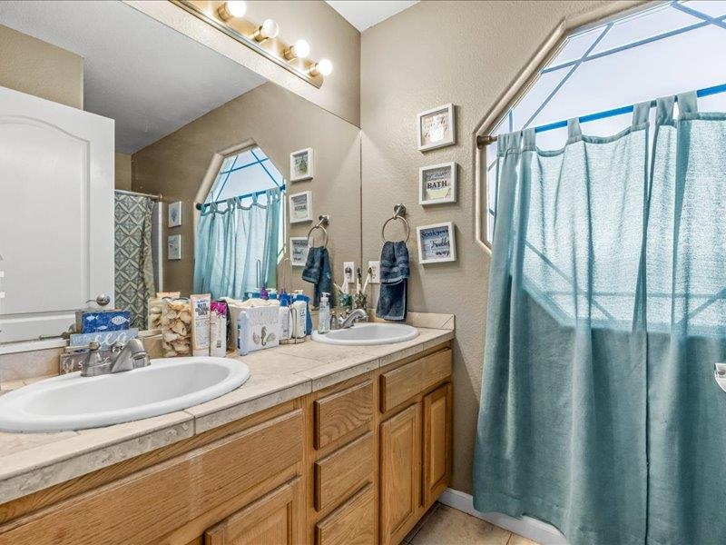 2860 B B 3/4 Road Grand Junction, CO 81503 - Photo 24 of 29 a bathroom with double vanity sink and a mirror