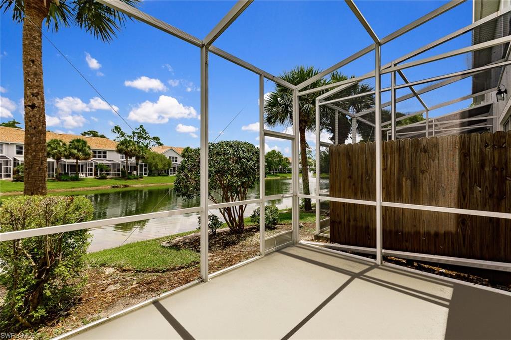 15451 Marcello Circle, Unit 229 Naples, FL 34110 - Photo 15 of 30 a view of a patio with a table and chairs