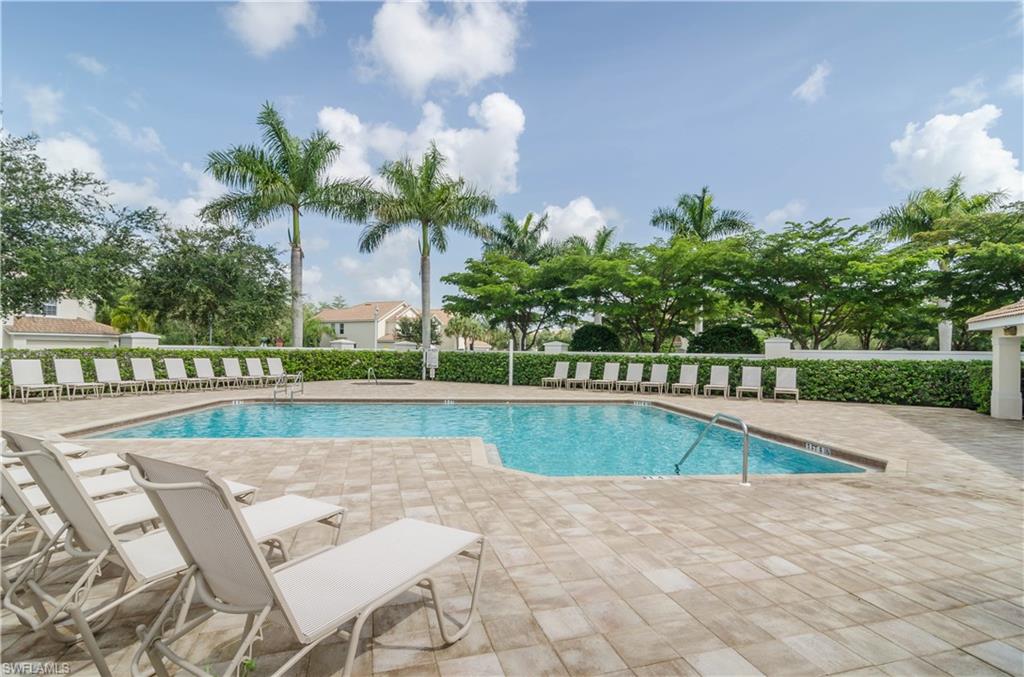 15451 Marcello Circle, Unit 229 Naples, FL 34110 - Photo 29 of 30 a view of swimming pool with outdoor space and seating area
