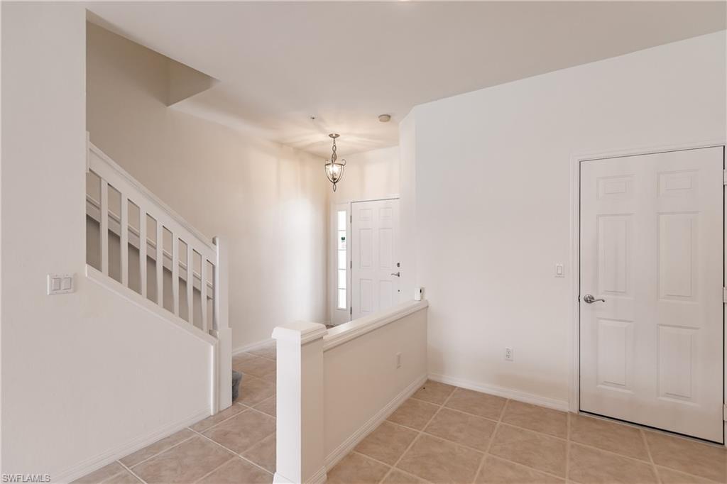 15451 Marcello Circle, Unit 229 Naples, FL 34110 - Photo 3 of 30 a view of an entryway with stairs