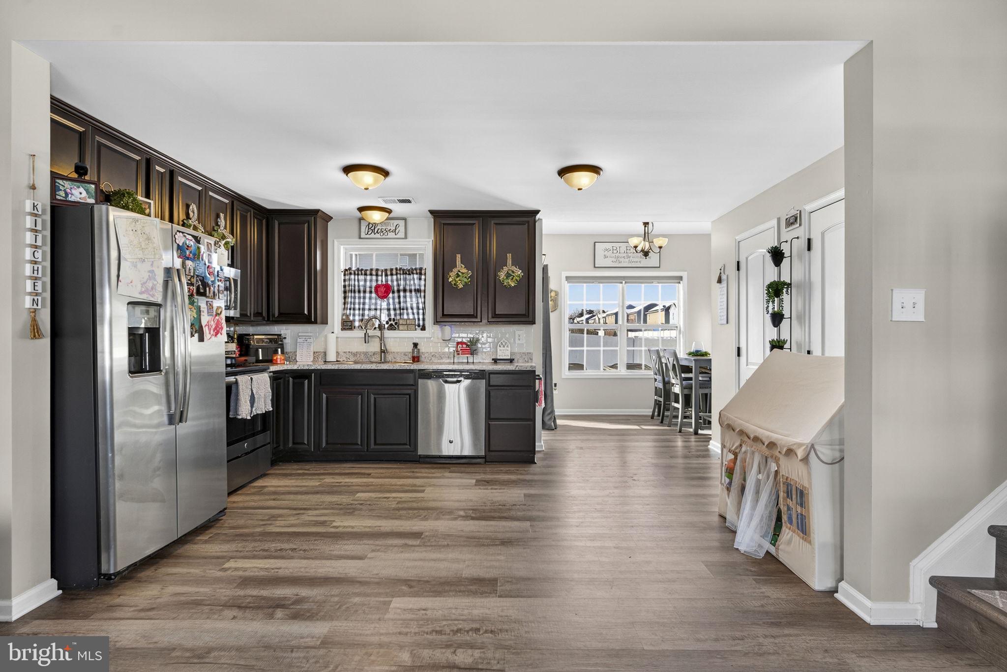 37 Knowledge Court Inwood, WV 25428 - Photo 16 of 53 a kitchen with stainless steel appliances granite countertop a refrigerator oven a sink dishwasher and a refrigerator