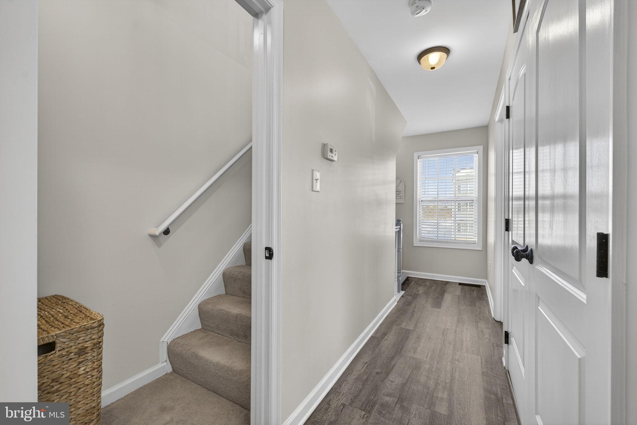 37 Knowledge Court Inwood, WV 25428 - Photo 28 of 53 a view of a hallway with wooden floor and staircase