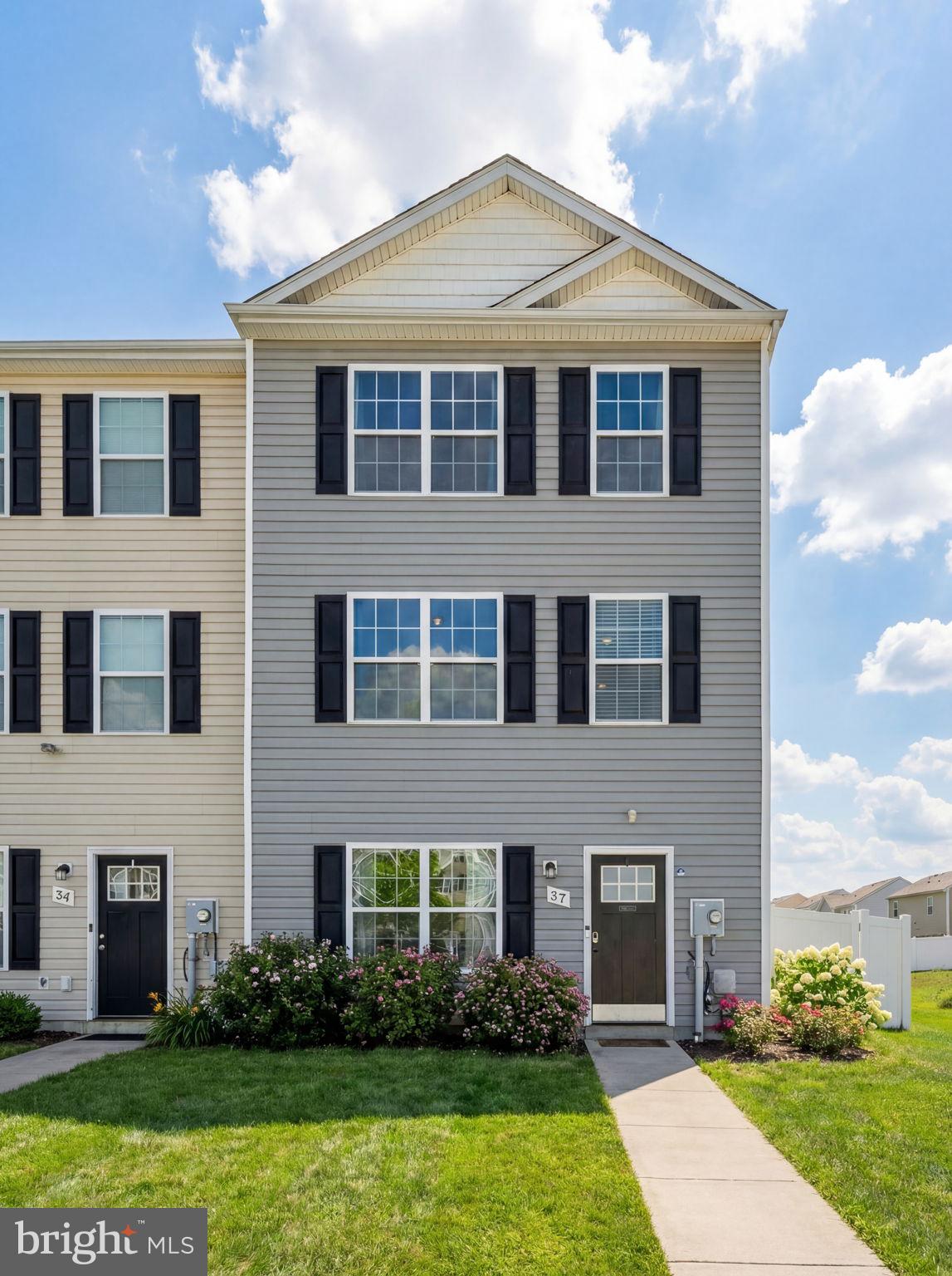 37 Knowledge Court Inwood, WV 25428 - Photo 3 of 53 a front view of a house with garden