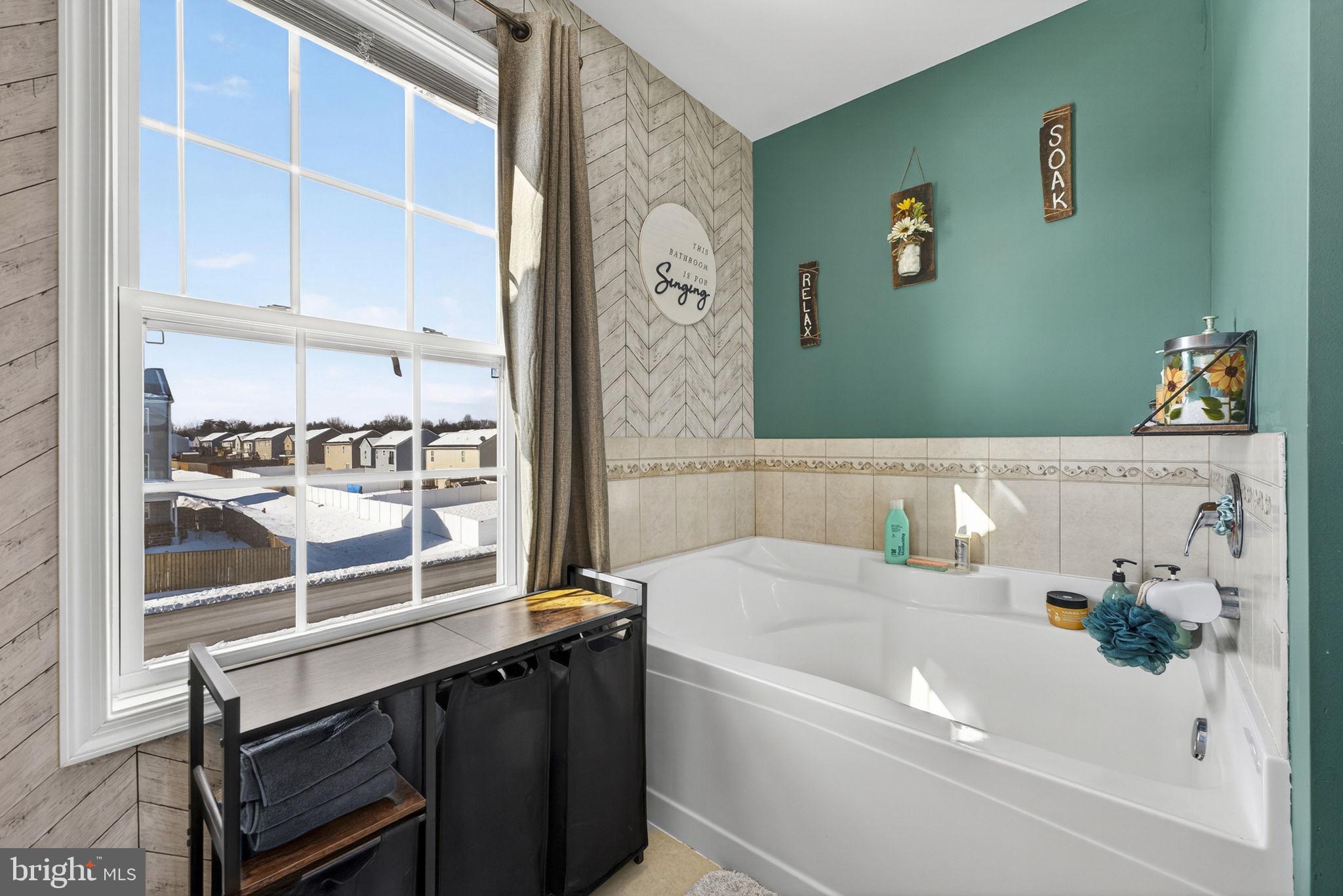 37 Knowledge Court Inwood, WV 25428 - Photo 36 of 53 a bathroom with a bathtub and a shower