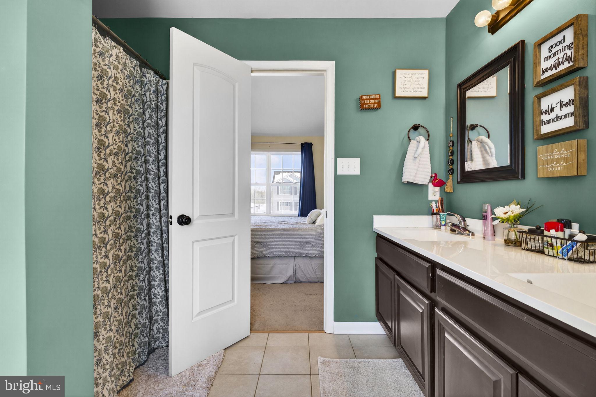 37 Knowledge Court Inwood, WV 25428 - Photo 37 of 53 a bathroom with a sink and a mirror