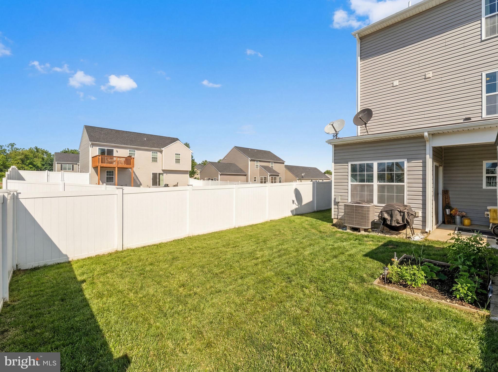 37 Knowledge Court Inwood, WV 25428 - Photo 39 of 53 a view of a backyard with table and chairs and wooden fence