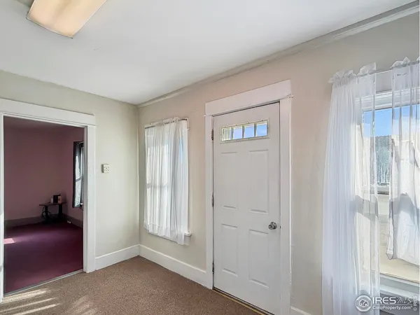 a view of a livingroom with a hallway