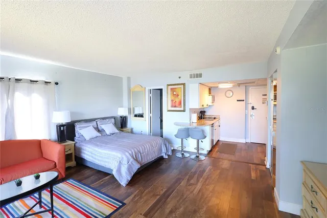 a bedroom with two beds and a window