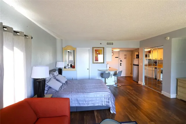 a bedroom with furniture and a window